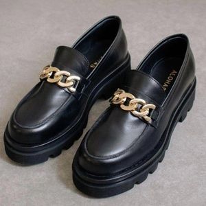 Alohas chunky black loafers with gold detail.